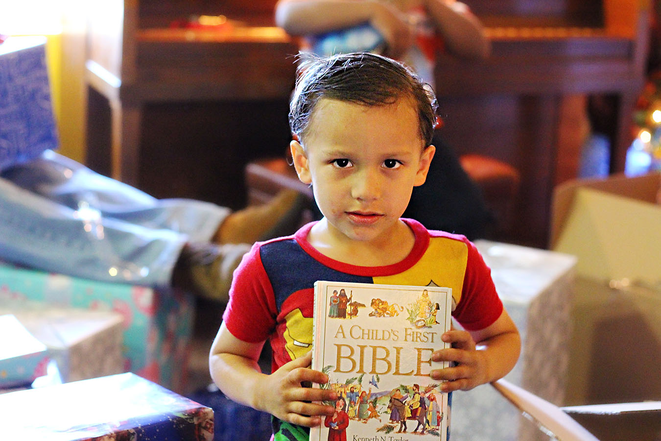 Junior with his very first Bible Story Book!!