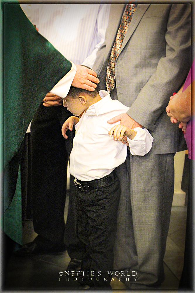 Efrain receiving the oil of chrism.
