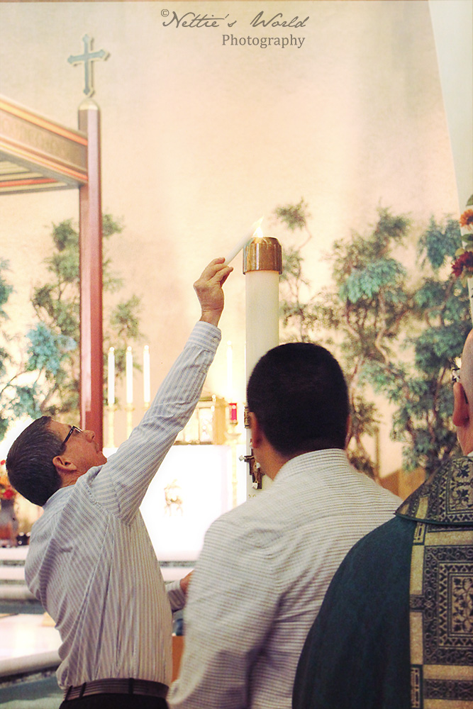 Lighting the baptismal candle.