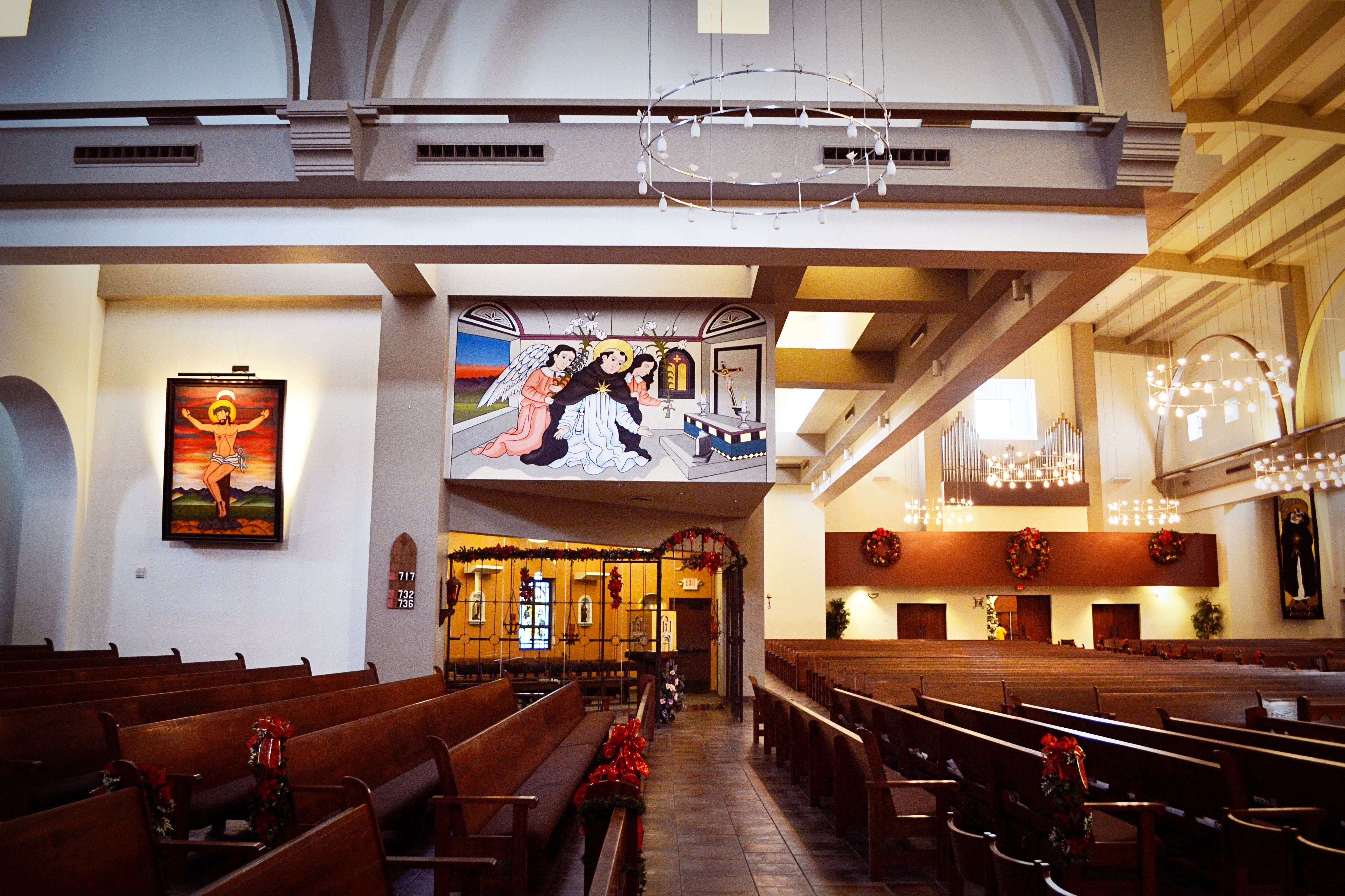 Standing near the piano, looking toward the back of the church.