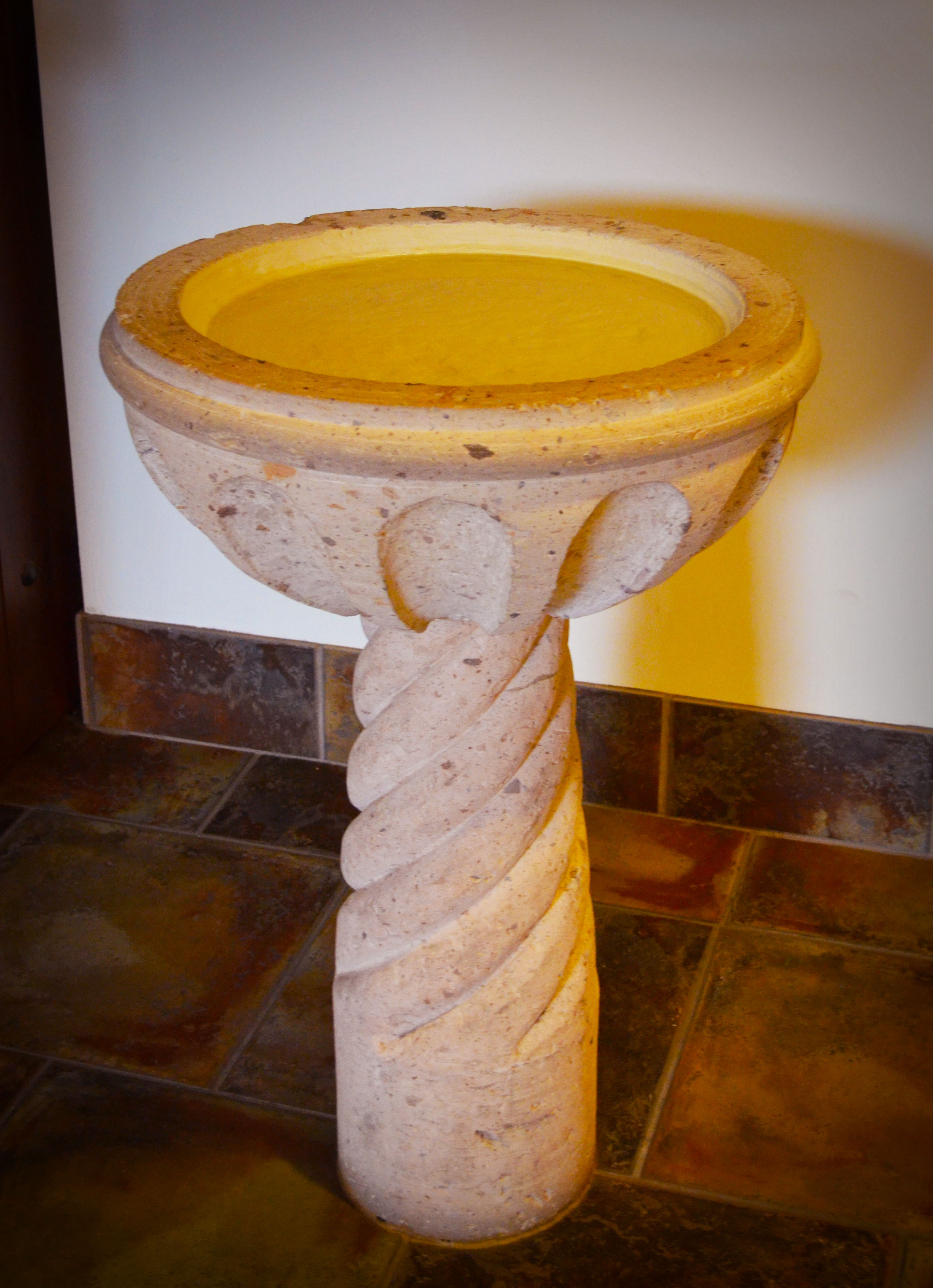 Our church has tiny little fonts for holy water hanging on the walls at the entrances -- this church goes big.