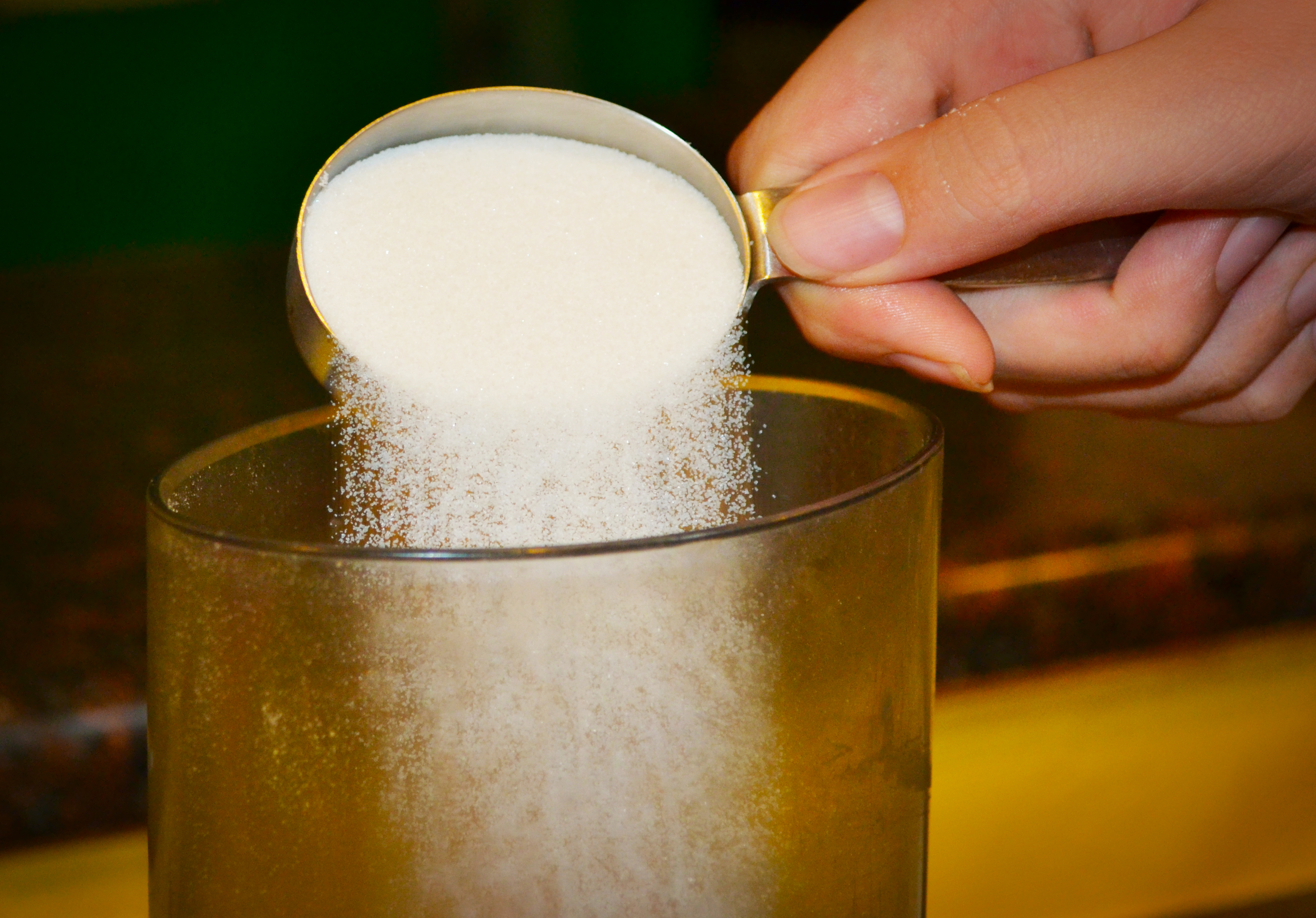 Step three, pour in a little sugar.