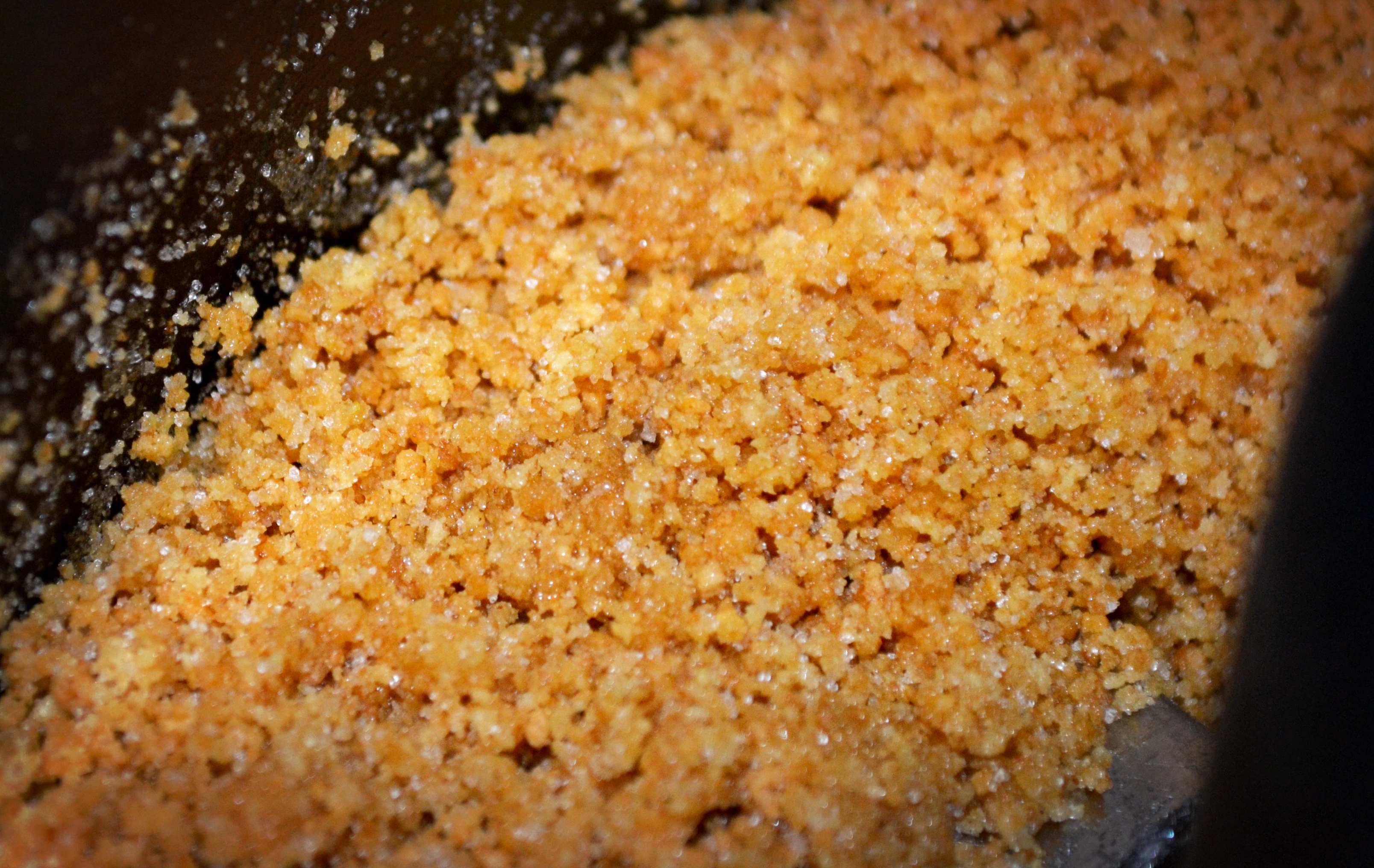 Step four, spin that blade around enough times to combine the butter and sugar with the crumbs.