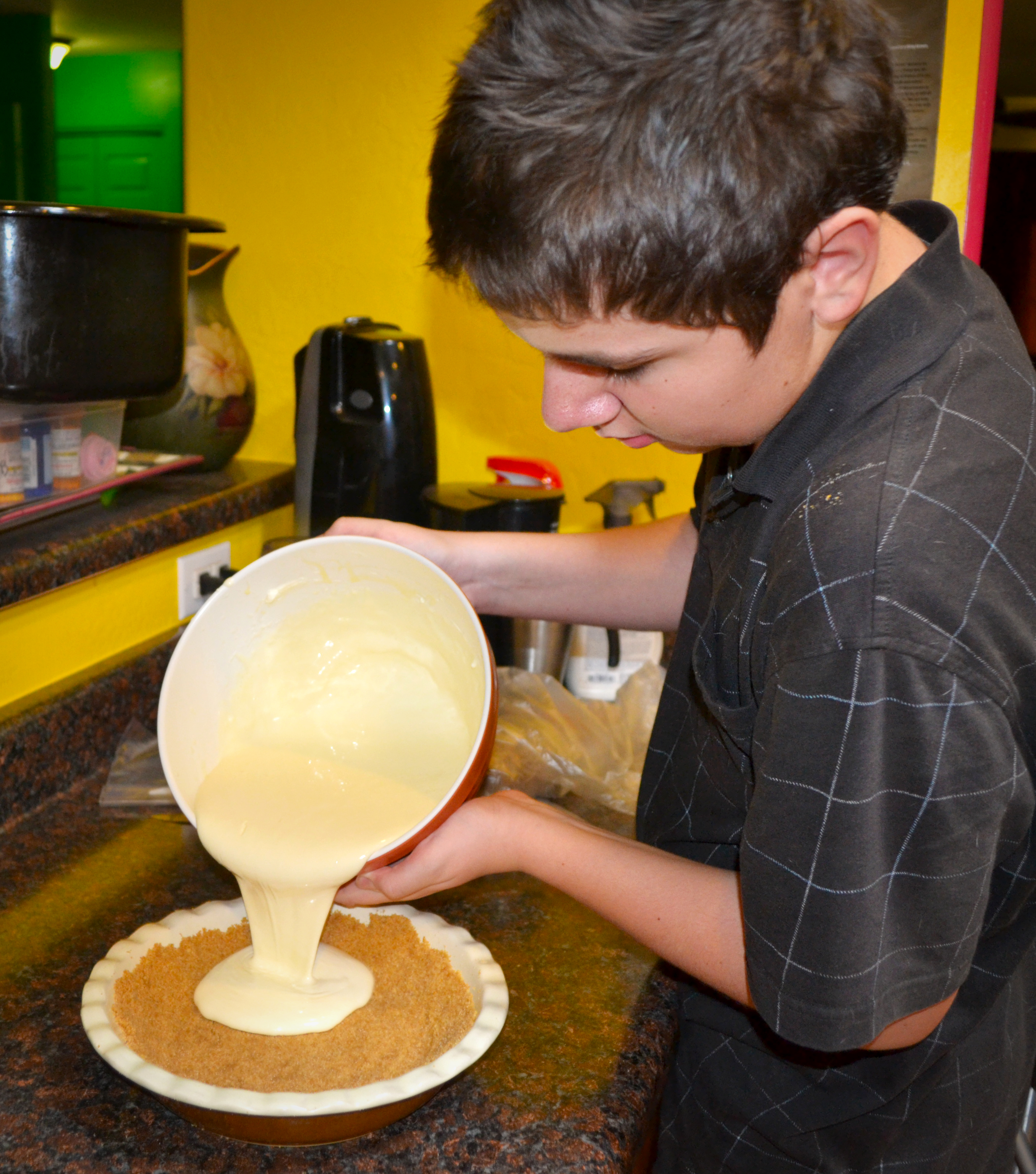 Step 14, pour the cheesecake batter into your prepared crust.