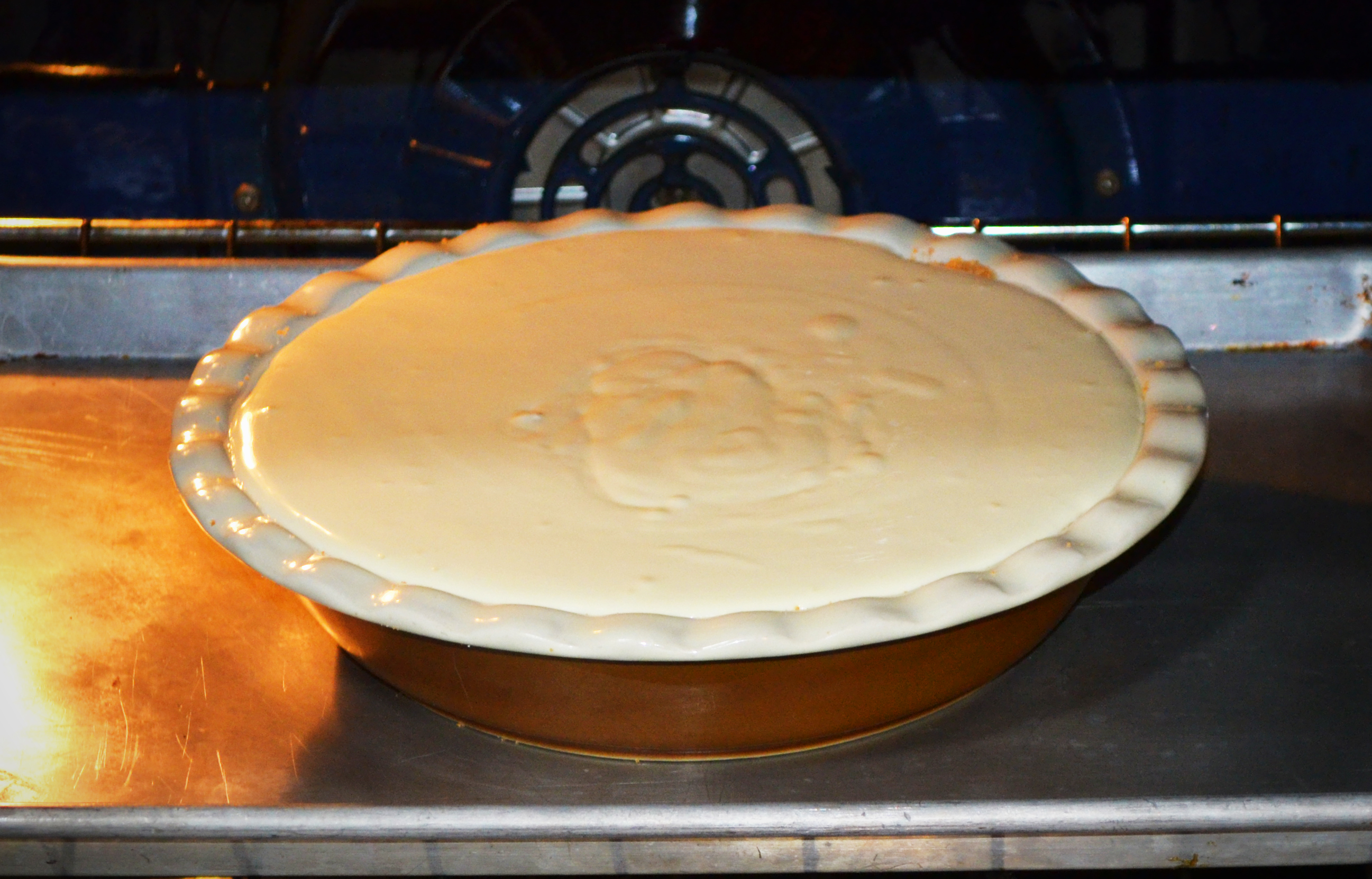 Place in preheated oven and bake for the prescribed amount of time.  If you mix it right, you bake it for 55 minutes, spread the sour cream on top, and bake for five more minutes.