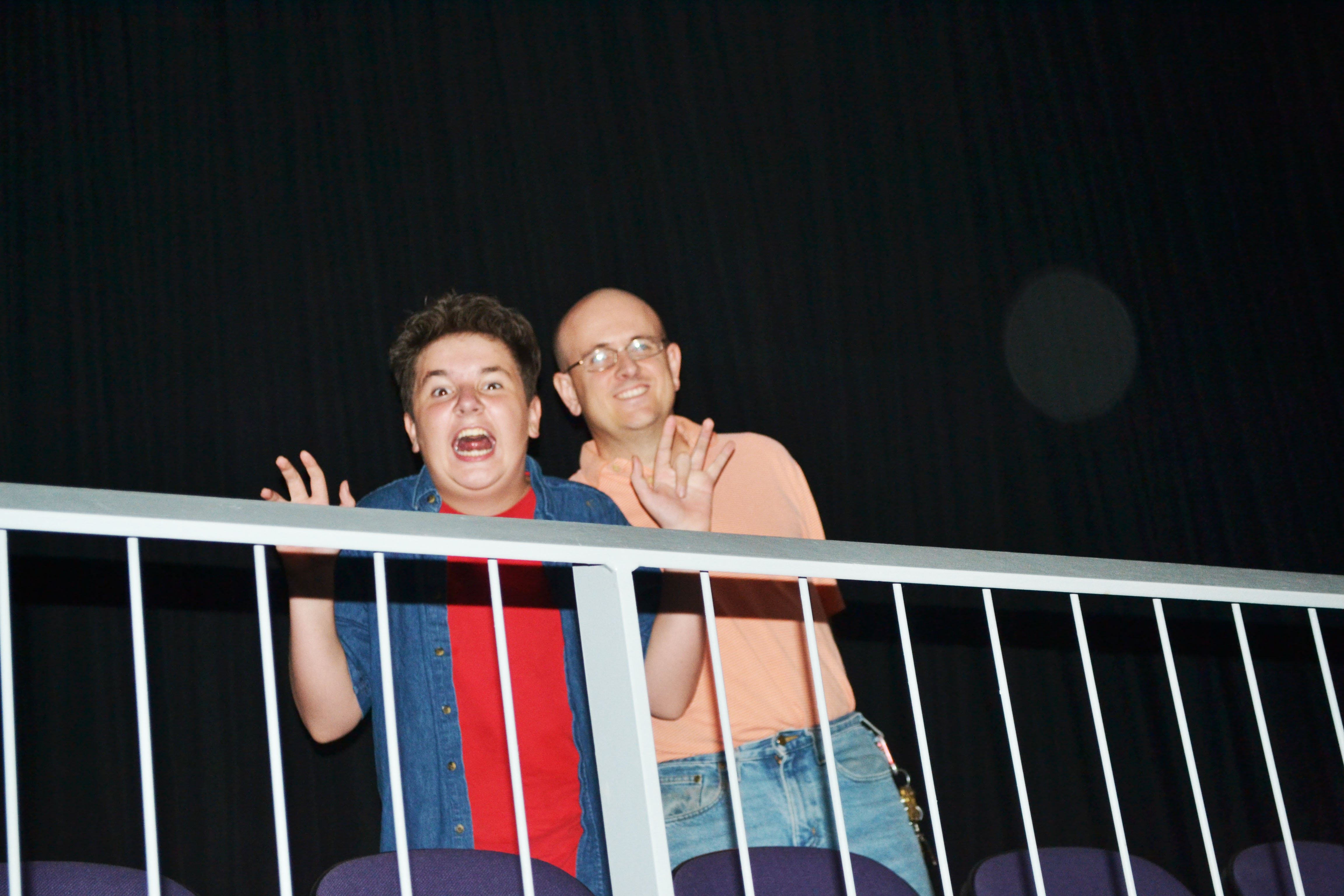 Jacob and Dad, having abandoned their seats, relaxing in the concourse.